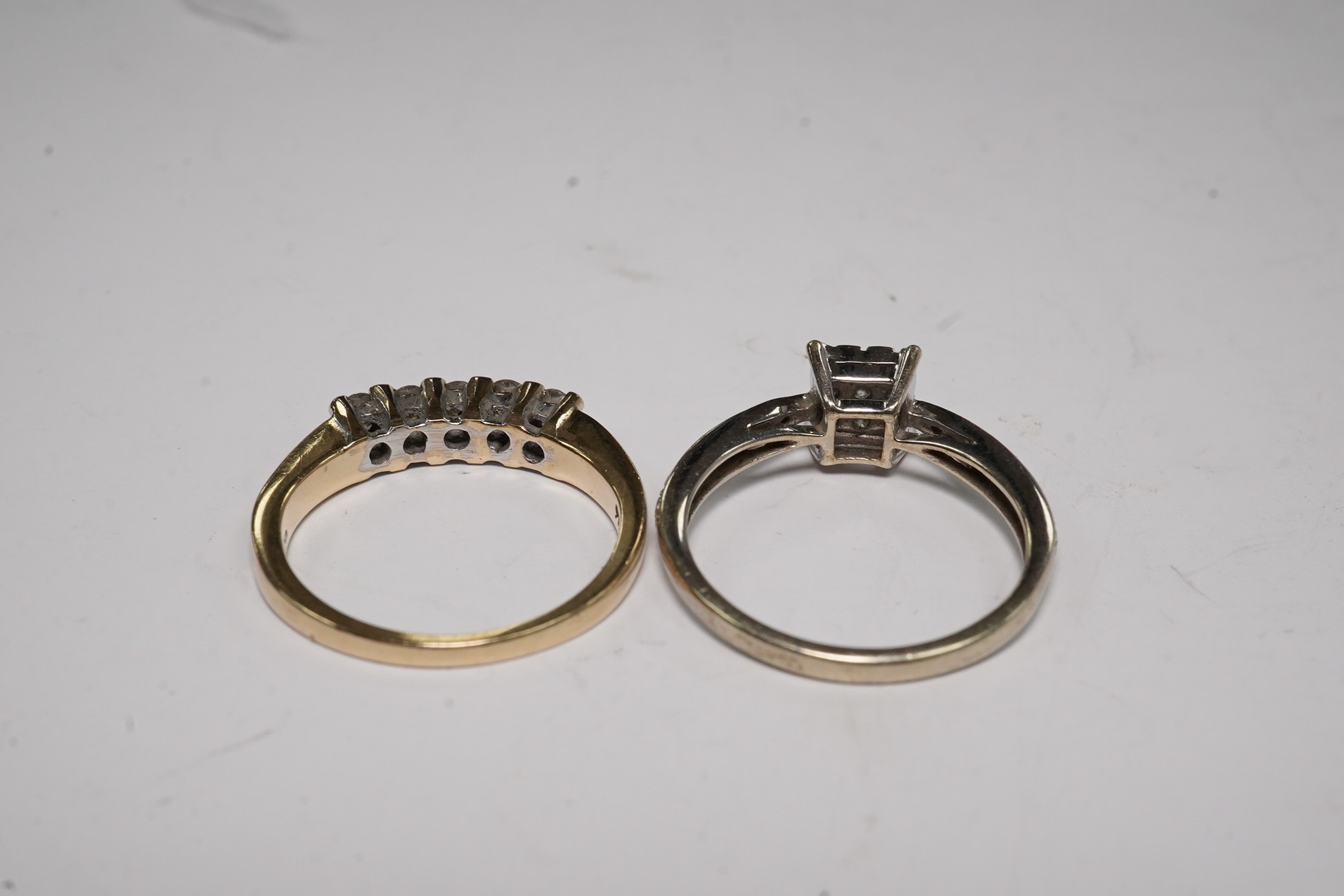 Two modern 9ct gold and diamond set rings, including square cluster and five stone half hoop, gross weight 4.2 grams.